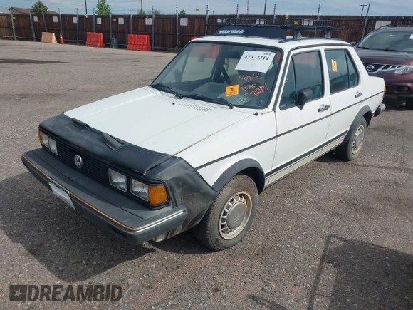 1982 Volkswagen Jetta z VIN WVWGA9161CW521961, wystawiony jako IAAI lot #42373314 z przebiegiem 52 051 mil mil oraz . Historia ofert i sprzedaży dostępna na DreamBid. Obrazek 2.