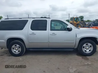 2011 Chevrolet Suburban LT with VIN 1GNSCJE05BR294452, listed as a IAAI auction lot 42107580 with 165,313 mi miles and . Bid and sale history available at DreamBid. Image 14.