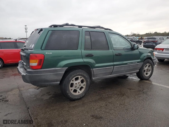 1999 Jeep Grand Cherokee Laredo with VIN 1J4GW58N0XC684111, listed as a Copart auction lot 85944784 with 128,741 mi miles and Salvage Title. Bid and sale history available at carsss.com. Image 3.