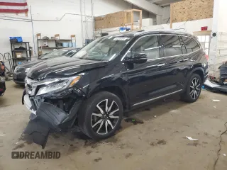 2019 Honda Pilot Touring 7-Passenger z VIN 5FNYF6H65KB092806, wystawiony jako Copart lot #54205085 z przebiegiem 130 219 mil mil oraz Szkoda całkowita • Salvage title. Historia ofert i sprzedaży dostępna na DreamBid. Obrazek 1.
