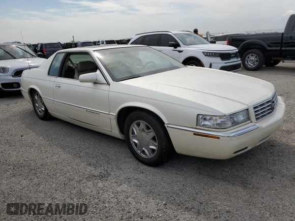 1999 Cadillac Eldorado z VIN 1G6EL12Y7XU615169, wystawiony jako Copart lot #76459744 z przebiegiem Nie podano mil oraz Szkoda całkowita • Salvage title. Historia ofert i sprzedaży dostępna na DreamBid. Obrazek 4.