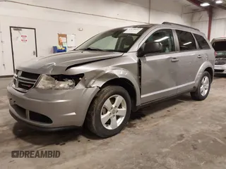 2015 Dodge Journey American Value z VIN 3C4PDCAB9FT675474, wystawiony jako IAAI lot #42078053 z przebiegiem 172 367 mil mil oraz . Historia ofert i sprzedaży dostępna na DreamBid. Obrazek 2.