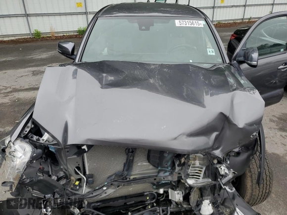2021 Toyota Tacoma SR z VIN 3TYCZ5ANXMT050566, wystawiony jako Copart lot #57315615 z przebiegiem Nie podano mil oraz Szkoda całkowita • Salvage title. Historia ofert i sprzedaży dostępna na DreamBid. Obrazek 11.