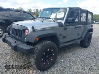 2014 Jeep Wrangler Unlimited Sport with VIN 1C4BJWDG3EL135351, listed as a IAAI auction lot 41947408 with 104,460 mi miles. Bid and sale history available at carsss.com. Image 17.