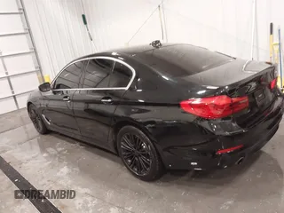 2018 BMW 5 Series 530i with VIN WBAJA5C52JWA37569, listed as a IAAI auction lot 41240799 with 80,116 mi miles and . Bid and sale history available at DreamBid. Image 3.