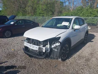2016 Mazda CX-5 Grand Touring with VIN JM3KE4DY1G0680431, listed as a IAAI auction lot 42136637 with 166,348 mi miles. Bid and sale history available at carsss.com. Image 21.
