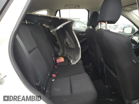 2015 Mazda CX-5 Sport z VIN JM3KE4BY2F0516574, wystawiony jako Copart lot #84100544 z przebiegiem Nie podano mil oraz Szkoda całkowita • Salvage title. Historia ofert i sprzedaży dostępna na DreamBid. Obrazek 12.