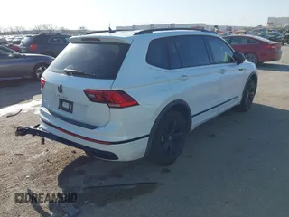 2024 Volkswagen Tiguan SE R-Line Black with VIN 3VVCB7AX0RM099863, listed as a IAAI auction lot 41851884 with 14,091 mi miles and . Bid and sale history available at DreamBid. Image 4.