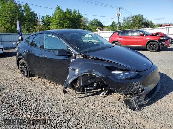 2023 Tesla Model Y Long Range z VIN 7SAYGDEE1PF865195, wystawiony jako Copart lot #57455765 z przebiegiem 32 011 mil mil oraz Szkoda całkowita • Salvage title. Historia ofert i sprzedaży dostępna na DreamBid. Obrazek 4.