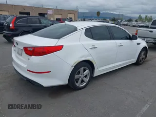 2015 Kia Optima LX with VIN KNAGM4A74F5662579, listed as a IAAI auction lot 42127251 with 144,138 mi miles and . Bid and sale history available at carsss.com. Image 4.