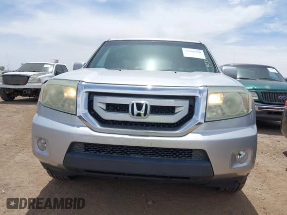2011 Honda Pilot Touring z VIN 5FNYF3H90BB006634, wystawiony jako IAAI lot #42388390 z przebiegiem 218 475 mil mil oraz . Historia ofert i sprzedaży dostępna na DreamBid. Obrazek 12.