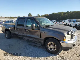 2003 Ford Super Duty F-250 XL with VIN 1FTNW20F73EB02536, listed as a Copart auction lot 77330394 with 170,102 mi miles and Salvage Title. Bid and sale history available at carsss.com. Image 4.