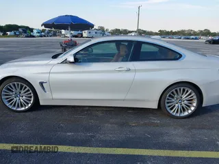2014 BMW 4 Series 435i with VIN WBA3R1C51EK192795, listed as a IAAI auction lot 41263037 with 22,937 mi miles and . Bid and sale history available at DreamBid. Image 14.