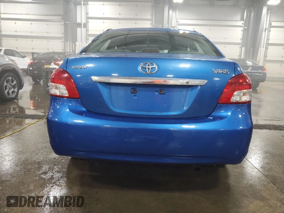 2009 Toyota Yaris with VIN JTDBT903991315725, listed as a Copart auction lot 52566735 with 177,044 mi miles and Salvage Title. Bid and sale history available at DreamBid. Image 6.