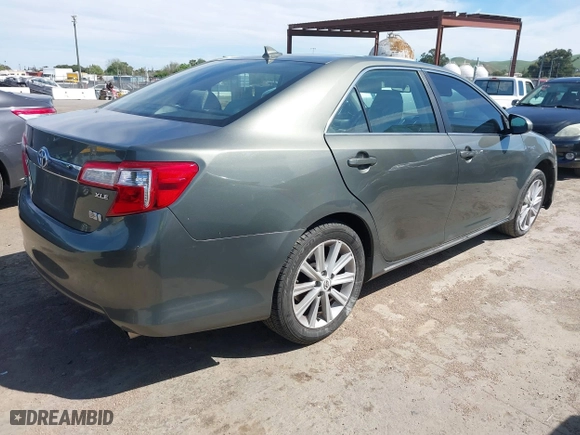 2012 Toyota Camry Hybrid XLE with VIN 4T1BD1FK0CU020723, listed as a IAAI auction lot 42031093 with 121,297 mi miles. Bid and sale history available at carsss.com. Image 4.