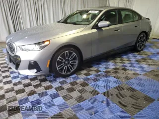 2024 BMW 5 Series 530i with VIN WBA43FJ0XRCS74003, listed as a Copart auction lot 43703145 with 7,942 mi miles and Clean Title. Bid and sale history available at carsss.com. Image 1.