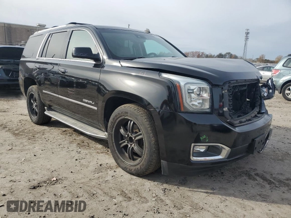 2015 GMC Yukon Denali with VIN 1GKS1CKJ1FR303049, listed as a Copart auction lot 82435514 with 100,693 mi miles and Salvage Title. Bid and sale history available at carsss.com. Image 4.