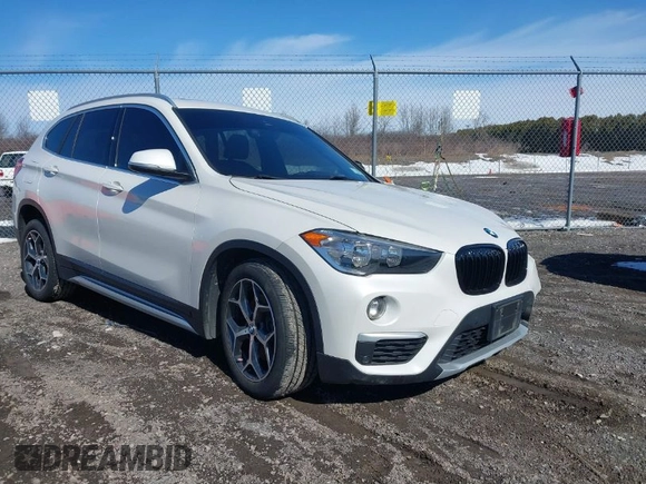 2019 BMW X1 xDrive28i with VIN WBXHT3C58K5N05523, listed as a IAAI auction lot 41752675 with 63,861 mi miles. Bid and sale history available at carsss.com. Image 1.