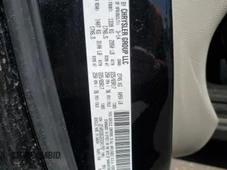 2014 Dodge Grand Caravan SE with VIN 2C4RDGBG2ER341797, listed as a Copart auction lot 49439405 with 102,633 mi miles and Salvage Title. Bid and sale history available at DreamBid. Image 15.