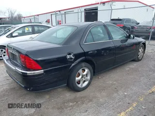 2002 Lincoln LS w/Base Pkg with VIN 1LNHM86S82Y701044, listed as a IAAI auction lot 41592614 with 192,902 mi miles. Bid and sale history available at carsss.com. Image 4.