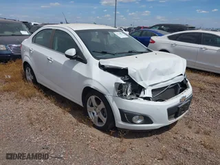 2014 Chevrolet Sonic LTZ with VIN 1G1JE5SB4E4227749, listed as a IAAI auction lot 38965556 with 69,550 mi miles. Bid and sale history available at carsss.com. Image 1.