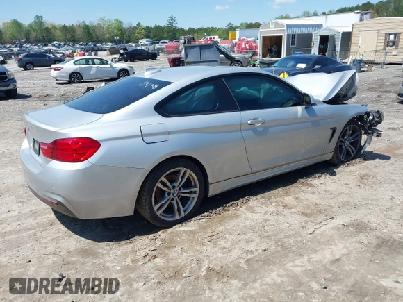 2014 BMW 4 Series 428i with VIN WBA3N7C50EK220438, listed as a IAAI auction lot 41990873 with 141,736 mi miles and . Bid and sale history available at carsss.com. Image 4.