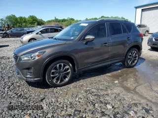 2016 Mazda CX-5 Grand Touring z VIN JM3KE4DY3G0762855, wystawiony jako Copart lot #58161755 z przebiegiem 121 933 mil mil oraz Szkoda całkowita • Salvage title. Historia ofert i sprzedaży dostępna na DreamBid. Obrazek 1.