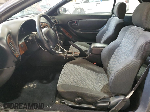 1997 Toyota Celica GT z VIN JT5FG02T3V0041206, wystawiony jako Copart lot #54601725 z przebiegiem 198 685 mil mil oraz Szkody całkowita. Historia ofert i sprzedaży dostępna na DreamBid. Obrazek 7.