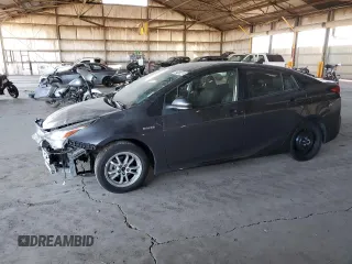 2021 Toyota Prius L Eco z VIN JTDKAMFU3M3149255, wystawiony jako Copart lot #84080374 z przebiegiem 99 794 mil mil oraz Szkoda całkowita • Salvage title. Historia ofert i sprzedaży dostępna na DreamBid. Obrazek 1.