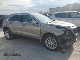 2022 Cadillac XT4 FWD Luxury with VIN 1GYAZAR4XNF121008, listed as a Copart auction lot 77599974 with 29,141 mi miles and Salvage title. Bid and sale history available at DreamBid. Image 4.