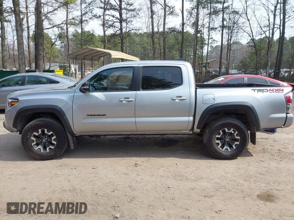 2022 Toyota Tacoma SR with VIN 3TMCZ5ANXNM497511, listed as a IAAI auction lot 41670710 with 26,277 mi miles and . Bid and sale history available at DreamBid. Image 14.