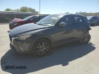 2017 Mazda CX-3 Touring z VIN JM1DKDC73H0172403, wystawiony jako Copart lot #47396355 z przebiegiem 79 865 mil mil oraz Szkoda całkowita • Salvage title. Historia ofert i sprzedaży dostępna na DreamBid. Obrazek 1.