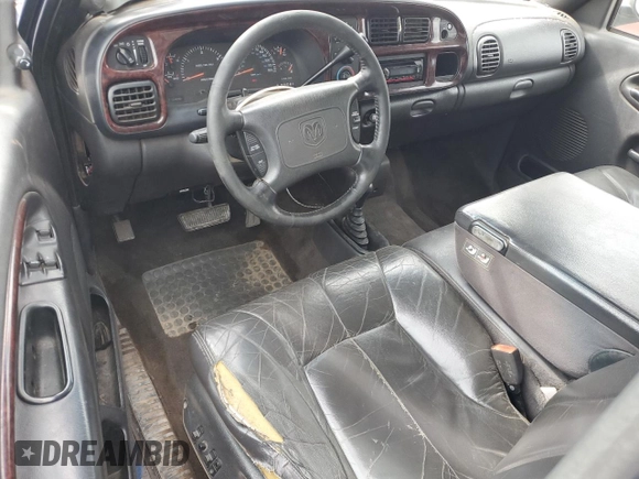 2001 Dodge 2500 z VIN 1B7KF236X1J198956, wystawiony jako Copart lot #52945405 z przebiegiem 216 448 mil mil oraz Czysty tytuł • Clean title. Historia ofert i sprzedaży dostępna na DreamBid. Obrazek 8.