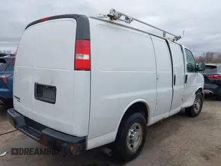2015 Chevrolet Express Cargo Van with VIN 1GCWGFCFXF1259591, listed as a IAAI auction lot 42029679 with 144,023 mi miles. Bid and sale history available at carsss.com. Image 4.