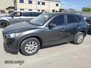 2016 Mazda CX-5 Touring z VIN JM3KE2CY9G0863372, wystawiony jako Copart lot #50707795 z przebiegiem 88 781 mil mil oraz Czysty tytuł • Clean title. Historia ofert i sprzedaży dostępna na DreamBid. Obrazek 1.