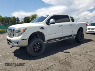 2016 Nissan Titan Platinum Reserve with VIN 1N6BA1F41GN504539, listed as a Copart auction lot 64812975 with 143,144 mi miles and Salvage title. Bid and sale history available at DreamBid. Image 1.