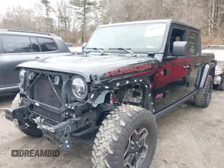 2021 Jeep Gladiator Rubicon z VIN 1C6JJTBG8ML524215, wystawiony jako IAAI lot #41829990 z przebiegiem 62 942 mil mil oraz . Historia ofert i sprzedaży dostępna na DreamBid. Obrazek 2.