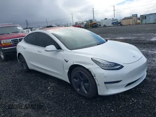 2018 Tesla Model 3 Long Range Battery with VIN 5YJ3E1EA3JF013253, listed as a IAAI auction lot 41752102 with 84,459 mi miles. Bid and sale history available at carsss.com. Image 1.