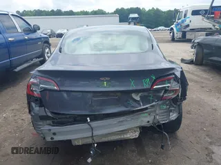 2023 Tesla Model 3 with VIN 5YJ3E1EAXPF628911, listed as a IAAI auction lot 42362410 with 25,387 mi miles and . Bid and sale history available at DreamBid. Image 17.