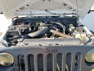 2010 Jeep Wrangler Sport with VIN 1J4AA2D16AL144842, listed as a Copart auction lot 50173535 with 106,000 mi miles and Salvage Title. Bid and sale history available at carsss.com. Image 11.