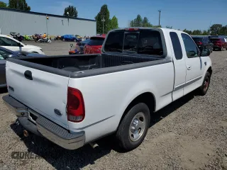 2002 Ford F-150 XL with VIN 1FTRX17L42NB56461, listed as a Copart auction lot 59988885 with 244,057 mi miles and Clean title. Bid and sale history available at DreamBid. Image 3.