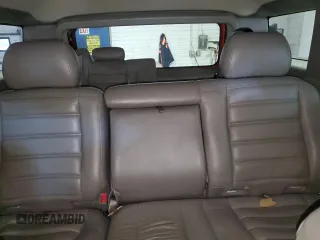 2003 Hummer H2 z VIN 5GRGN23U03H113929, wystawiony jako Copart lot #49540455 z przebiegiem 126 254 mil mil oraz Tytuł czysty. Historia ofert i sprzedaży dostępna na DreamBid. Obrazek 10.
