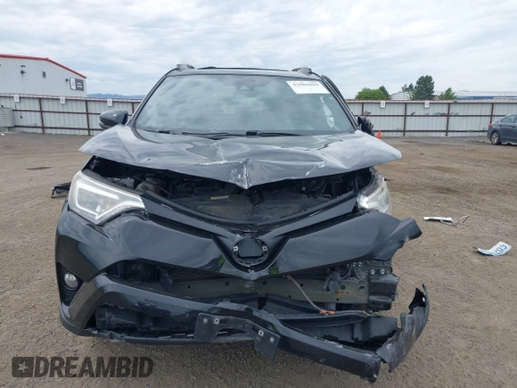 2018 Toyota RAV4 SE with VIN 2T3JFREV1JW730203, listed as a IAAI auction lot 42504455 with 99,442 mi miles and . Bid and sale history available at DreamBid. Image 13.