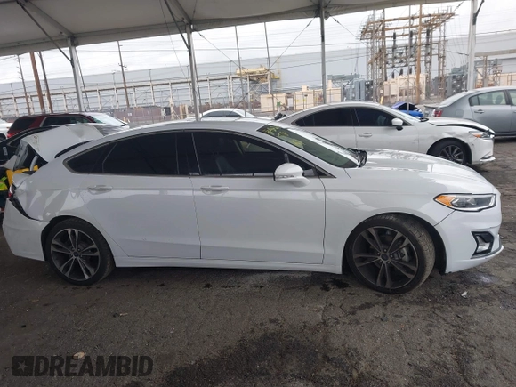 2019 Ford Fusion Titanium with VIN 3FA6P0K90KR236674, listed as a IAAI auction lot 42008633 with 99,737 mi miles and . Bid and sale history available at DreamBid. Image 13.