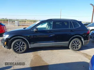 2021 Volkswagen Tiguan SE z VIN 3VV3B7AX0MM080853, wystawiony jako IAAI lot #42406539 z przebiegiem 73 295 mil mil oraz . Historia ofert i sprzedaży dostępna na DreamBid. Obrazek 15.