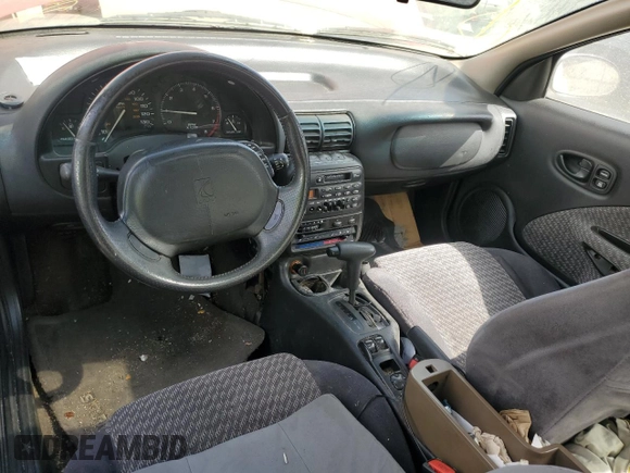 1999 Saturn SC z VIN 1G8ZY127XXZ314531, wystawiony jako Copart lot #49653805 z przebiegiem 130 457 mil mil oraz Szkody całkowita. Historia ofert i sprzedaży dostępna na DreamBid. Obrazek 8.