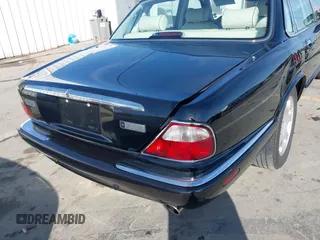 2003 Jaguar XJ 8 with VIN SAJDA14C03LF58706, listed as a IAAI auction lot 41619740 with 95,293 mi miles and . Bid and sale history available at DreamBid. Image 16.