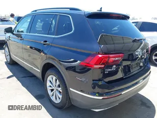 2018 Volkswagen Tiguan SEL z VIN 3VV3B7AX3JM210300, wystawiony jako IAAI lot #42189355 z przebiegiem 83 802 mil mil oraz . Historia ofert i sprzedaży dostępna na DreamBid. Obrazek 3.
