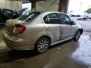 2010 Suzuki SX4 with VIN JS2YC5A49A6310256, listed as a Copart auction lot 73210584 with 135,021 mi miles and Salvage Title. Bid and sale history available at DreamBid. Image 3.