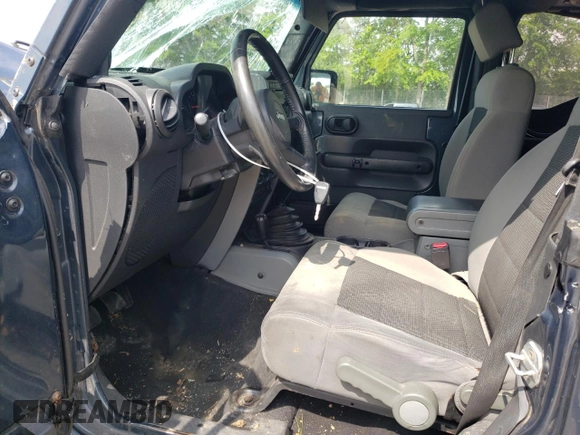2008 Jeep Wrangler X with VIN 1J4FA24158L563572, listed as a Copart auction lot 58667265 with 162,649 mi miles and Salvage title. Bid and sale history available at DreamBid. Image 7.